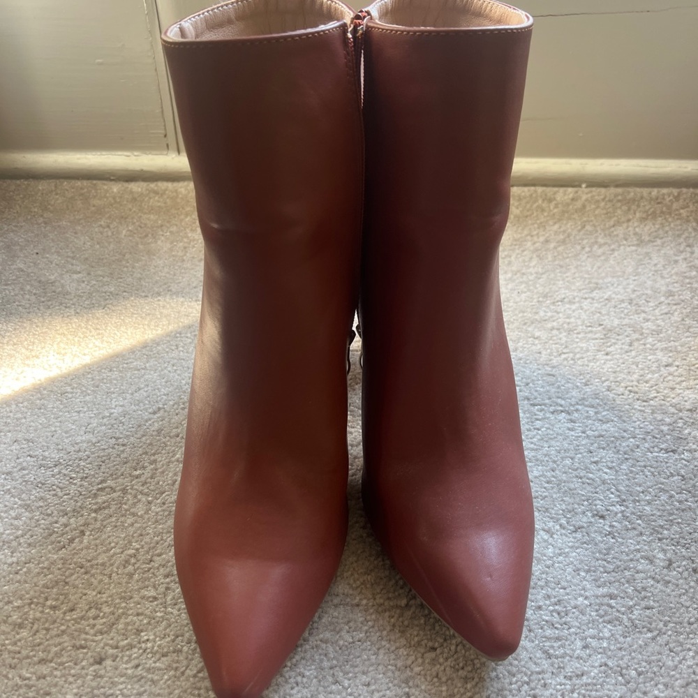 Brown booties and black knee high boots